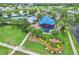 Aerial view of recreation center with pool, playground and lush landscaping in a well maintained community at 12618 Lakebrook Dr, Orlando, FL 32828
