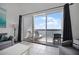 Inviting waterfront balcony furnished with lounge chairs and outdoor seating; beautiful lake views at 13415 Blue Heron Beach Dr # 1503, Orlando, FL 32821