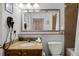 Bathroom featuring a granite vanity, a commode, a large mirror, and a shower/tub combination at 13415 Blue Heron Beach Dr # 1503, Orlando, FL 32821