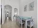 Cozy dining area with seating for four and coastal artwork at 13415 Blue Heron Beach Dr # 1503, Orlando, FL 32821