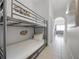 Hallway featuring a bunk bed, a tiled floor, and Disney themed decor at 13415 Blue Heron Beach Dr # 1503, Orlando, FL 32821