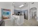 Modern kitchen with stainless steel appliances and breakfast bar seating at 13415 Blue Heron Beach Dr # 1503, Orlando, FL 32821