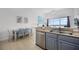 Open kitchen with granite countertops and eat-in dining area at 13415 Blue Heron Beach Dr # 1503, Orlando, FL 32821