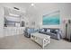 Bright living room with tile floors, comfortable seating, and beach-themed decor at 13415 Blue Heron Beach Dr # 1503, Orlando, FL 32821