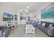 Bright living area with open floor plan, coastal decor, and tile flooring at 13415 Blue Heron Beach Dr # 1503, Orlando, FL 32821