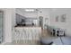 Open-concept living space with breakfast bar, dining area and modern appliances at 13415 Blue Heron Beach Dr # 1503, Orlando, FL 32821