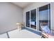 Balcony has outdoor seating area with chairs and opens into a bedroom through sliding glass doors at 13427 Blue Heron Beach Dr # 2003, Orlando, FL 32821