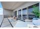 Relaxing balcony featuring comfortable lounge seating and picturesque views through sliding glass doors at 13427 Blue Heron Beach Dr # 2003, Orlando, FL 32821