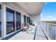 Wide condo balcony has ample space, seating, and views of nature at 13427 Blue Heron Beach Dr # 2003, Orlando, FL 32821