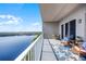 Relaxing condo balcony with furniture, decor, and a stunning view of the lake at 13427 Blue Heron Beach Dr # 2003, Orlando, FL 32821