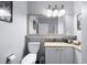 Cozy bathroom featuring a toilet and modern vanity with marble countertop at 13427 Blue Heron Beach Dr # 2003, Orlando, FL 32821