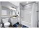 Cozy bathroom featuring a tub with shower, toilet, and modern vanity at 13427 Blue Heron Beach Dr # 2003, Orlando, FL 32821