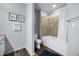 Well-lit bathroom with a shower-tub combo and modern fixtures at 13427 Blue Heron Beach Dr # 2003, Orlando, FL 32821