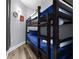 Cozy bedroom with a bunk bed and matching decor throughout at 13427 Blue Heron Beach Dr # 2003, Orlando, FL 32821