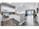 Bright kitchen with white cabinets and updated appliances overlooking the living area and great views at 13427 Blue Heron Beach Dr # 2003, Orlando, FL 32821
