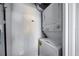 A clean and efficient laundry room with a stacked washer and dryer at 13427 Blue Heron Beach Dr # 2003, Orlando, FL 32821
