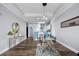 Bright open floor plan showcases modern decor, wood floors, and a breakfast bar with seating at 13427 Blue Heron Beach Dr # 2003, Orlando, FL 32821