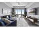 Cozy living room with a sectional sofa and a large sliding glass door to the balcony with lake views at 13427 Blue Heron Beach Dr # 2003, Orlando, FL 32821