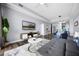 Open-concept living room features a TV, modern furniture, and seamless flow to dining and kitchen at 13427 Blue Heron Beach Dr # 2003, Orlando, FL 32821