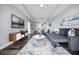Spacious living area with modern furnishings, a large rug, and a view into the kitchen and dining at 13427 Blue Heron Beach Dr # 2003, Orlando, FL 32821