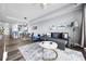 Comfortable living room with plush seating, stylish rug, and a view of the kitchen and dining area at 13427 Blue Heron Beach Dr # 2003, Orlando, FL 32821