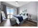 Serene bedroom with a plush bed, balcony access, and scenic water views at 13427 Blue Heron Beach Dr # 2003, Orlando, FL 32821