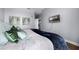 Stylish bedroom featuring a comfortable bed, calming colors, and a view into the kitchen at 13427 Blue Heron Beach Dr # 2003, Orlando, FL 32821