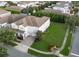 Two-story home with a three-car garage and manicured lawn in a residential area at 14572 Black Quill Dr, Winter Garden, FL 34787