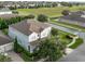 Two-story home with mature trees and landscaping in a suburban neighborhood at 14572 Black Quill Dr, Winter Garden, FL 34787