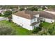Two-story home with manicured lawn and shrubbery in a well-kept neighborhood at 14572 Black Quill Dr, Winter Garden, FL 34787