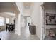 Bright foyer with arched doorways leads to the dining room and living spaces, showcasing an open floor plan at 14572 Black Quill Dr, Winter Garden, FL 34787