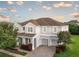 Charming two-story home with a three-car garage and well-manicured landscaping at 14572 Black Quill Dr, Winter Garden, FL 34787
