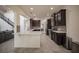 Spacious kitchen with dark wood cabinets, stainless steel appliances, and an island at 14572 Black Quill Dr, Winter Garden, FL 34787