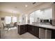 Bright kitchen featuring wooden cabinets, modern appliances, and large windows for natural light at 14572 Black Quill Dr, Winter Garden, FL 34787
