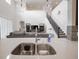 Kitchen sink and counters with view of the living room and high ceilings at 14572 Black Quill Dr, Winter Garden, FL 34787