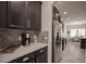 Kitchen with sleek stainless steel appliances, and a view of the dining area at 14572 Black Quill Dr, Winter Garden, FL 34787