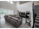 Open living room area with high ceilings, stairs, and sliding glass doors at 14572 Black Quill Dr, Winter Garden, FL 34787