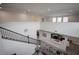 Bright, open living space with high ceilings, modern decor, and staircase at 14572 Black Quill Dr, Winter Garden, FL 34787