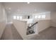 Bright upstairs landing with carpet and railings at 14572 Black Quill Dr, Winter Garden, FL 34787
