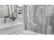 Modern bathroom featuring a sleek vanity, stylish fixtures, and a glass-enclosed shower with elegant tile work at 1613 Bellagio Loop, Tavares, FL 32778