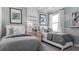 Stylish bedroom featuring two twin beds, chic decor, and a soothing color palette, creating a comfortable and inviting atmosphere at 1613 Bellagio Loop, Tavares, FL 32778