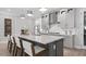Stylish kitchen featuring a large island with bar seating, modern appliances, and elegant finishes at 1613 Bellagio Loop, Tavares, FL 32778