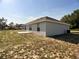 Backyard featuring a back porch and green grass at 1715 Redfin Way, Kissimmee, FL 34759