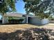 Beautiful single-story home with a well-manicured lawn and lush landscaping at 1715 Redfin Way, Kissimmee, FL 34759
