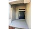 Welcoming front entry with a stylish blue door and covered porch at 1715 Redfin Way, Kissimmee, FL 34759
