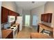 Efficient kitchen boasting tile floors, ample counter space, and modern appliances at 1715 Redfin Way, Kissimmee, FL 34759