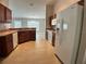 Functional kitchen featuring tile floors, ample cabinets, and modern appliances at 1715 Redfin Way, Kissimmee, FL 34759