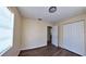 A bedroom featuring wood-look flooring and a window at 2031 Warrens Ave, Maitland, FL 32751