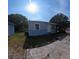 Exterior shot showcasing home with shed, lawn, and driveway at 2031 Warrens Ave, Maitland, FL 32751