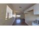 Open floor plan showcasing light paint, wood floors, kitchenette, and windows at 2031 Warrens Ave, Maitland, FL 32751